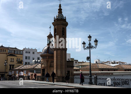 The Capilla del Carmen is a small chapel located on the Puente de Isobel 11 ( Bridge of Isobel 11)  that spans the river Guadalquivir in Seville, Anda Stock Photo