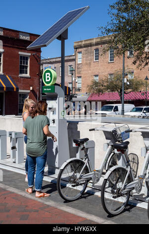 Savannah, Georgia.  Solar-powered Bike Rental Station, Ellis Square. Stock Photo