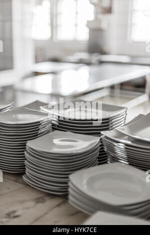 Stack of many white different plates Stock Photo