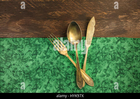 Vintage fork and knife on wooden background Stock Photo