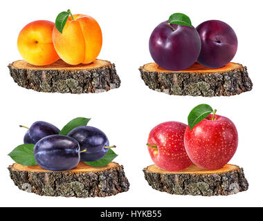 Apples, apricots and plums isolated on a tree stump isolated on white background Stock Photo