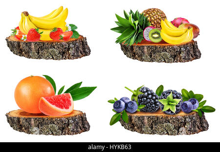 Collection of fruits  isolated on a tree stump isolated on white background Stock Photo
