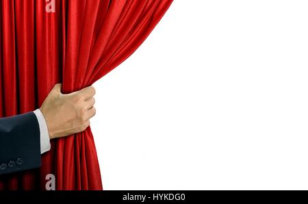Hand opening stage red curtain over white Stock Photo