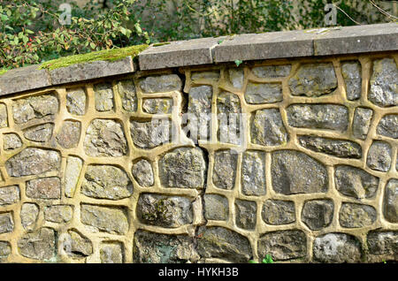 Cracked garden stone wall (Kent, UK) Stock Photo