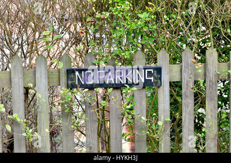 No Parking sign on a garden fence. Loose Village, Kent, England. Stock Photo