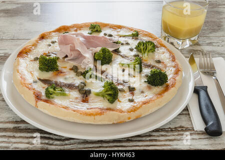 whole pizza with ham Stock Photo