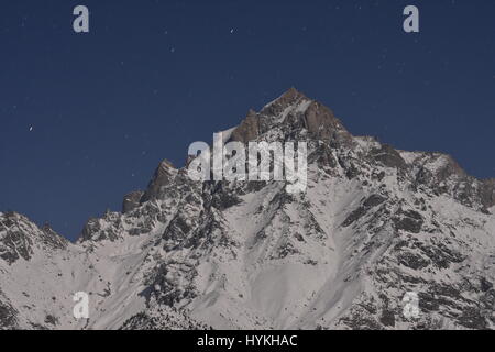 Kinnaur Kailash range in Moonlight, Kalpa, Himachal Pradesh, India Stock Photo