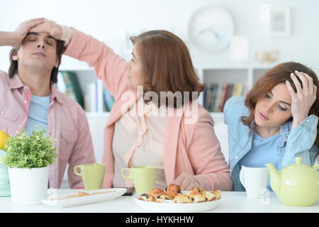 Happy family drinking tea together Stock Photo