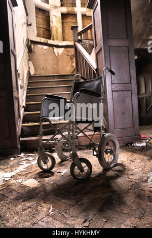 MALVERN, ENGLAND:  A picture of a wheelchair at the foot of the stairs.  LOOK INSIDE the home where heroic nurse Florence Nightingale believed her life was saved upon returning to Britain from her service during the Crimean War. Pictures show the one time centre for ‘water cure’ treatment in Malvern, Malvernbury, which became a frequent stop for Florence Nightingale between 1857 and 1860 while she recovered from the effects of war which left her suffering severe anxiety and exertion. Another famous convert to Malvern’s water cure included Charles Darwin who stated after four months of treatmen Stock Photo