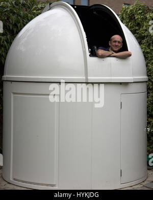 Roger and his observatory. LONDON, UK: DEFYING the light pollution of our capital city these stunning images of outer space have been taken by an amateur astronomer from his back garden in West London. Rivalling images taken by multimillion dollar spacecraft, the spectacular shots show incredible close-ups of the moon including the Apollo 15 landing site, Jupiter and Mercury. Other pictures show the International Space Station passing over London, a comet whizzing by and the moon rising high into the night sky. The awesome array of photos were taken by IT solutions architect and amateur astron Stock Photo