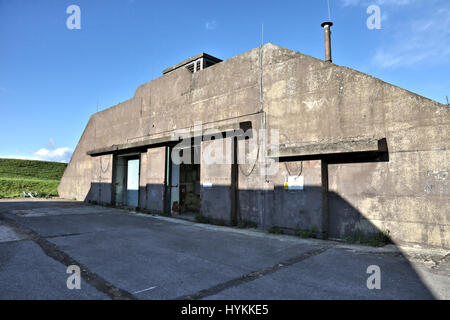 UPPER HEYFORD, UK: WELCOME to the abandoned RAF base where both Roger Moore and Brad Pitt starred in movies where they single handedly saved the world. Haunting pictures of the one-hundred-year old base show the slowly decaying facilities at RAF Upper Heyford, which is one of the oldest military air force bases on the planet and was the centre of US airpower in Europe during WW2. Images show a rusting generator, ammunition boxes and heavy metal sheet buildings still in place and where the movie blockbusters such as Bond film, Octopussy and Zombie flick, World War Z were both filmed. Other shot Stock Photo