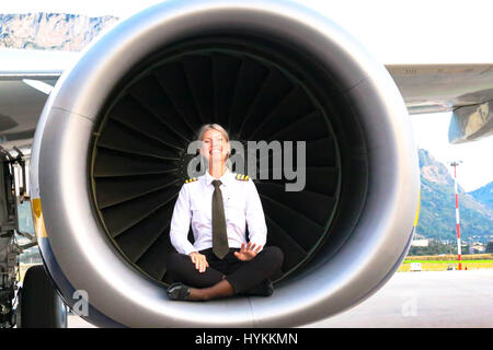 A BLONDE bombshell pilot has been documenting her sizzling hot globe-trotting lifestyle with a series of cockpit selfies that have launched her into Instagram stardom. With 126 thousand Instagram followers and climbing, awesome pictures show Maria Pettersson (32) hanging out a cockpit window, sitting inside an aircraft engine turbine and operating the controls in preparation for take-off. Other images show the Swedish pilot’s airplane lunch, relaxing as she practices yoga on a sunny beach and taking some time out to paddle board. Maria, from Gothenburg in Sweden but now living in Palermo in Si Stock Photo