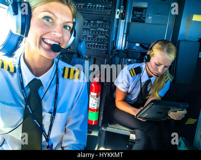 A BLONDE bombshell pilot has been documenting her sizzling hot globe-trotting lifestyle with a series of cockpit selfies that have launched her into Instagram stardom. With 126 thousand Instagram followers and climbing, awesome pictures show Maria Pettersson (32) hanging out a cockpit window, sitting inside an aircraft engine turbine and operating the controls in preparation for take-off. Other images show the Swedish pilot’s airplane lunch, relaxing as she practices yoga on a sunny beach and taking some time out to paddle board. Maria, from Gothenburg in Sweden but now living in Palermo in Si Stock Photo