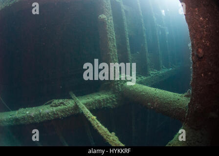 SPECTACULAR underwater pictures have revealed the 600-foot long remains of an American luxury ocean liner-turned US troopship which was sunk by mines in WW2. The stunning shots show the vast 13,000 ton wreck of the SS President Coolidge at the bottom of the Pacific, but the intrepid divers overcame the dangers of deep sea wreck diving by venturing inside the hulk. Some of the luxurious interior is still visible under huge layers of silt while huge shells were pulled from the wreckage as-well-as ordinary everyday items, including bottles and pots left untouched since she sank off Espiritu Santo Stock Photo