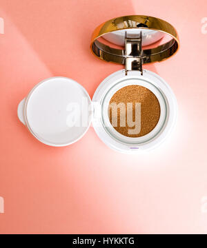 Foundation cushion with sponge and puff on white background. Stock Photo