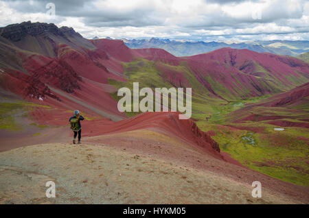 VINICUNCA MOUNTAIN, PERU: STUNNING pictures have revealed one of the world’s hidden gems as the remarkable multi-coloured landscape has saw this place dubbed Rainbow Mountain. The spectacular shots show the rainbow colours along the ridge of the 16,500ft Vinicunca Mountain and spilling below while other images illustrate the idyllic trek one must take to get there. Peru is best known for Machu Picchu, a 15th-century Inca citadel situated on a mountain ridge 7,970 ft above sea level, but Rainbow Mountain proves it is not all the country has to offer. The photos were taken by American traveler a Stock Photo