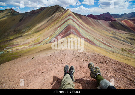 VINICUNCA MOUNTAIN, PERU: STUNNING pictures have revealed one of the world’s hidden gems as the remarkable multi-coloured landscape has saw this place dubbed Rainbow Mountain. The spectacular shots show the rainbow colours along the ridge of the 16,500ft Vinicunca Mountain and spilling below while other images illustrate the idyllic trek one must take to get there. Peru is best known for Machu Picchu, a 15th-century Inca citadel situated on a mountain ridge 7,970 ft above sea level, but Rainbow Mountain proves it is not all the country has to offer. The photos were taken by American traveler a Stock Photo