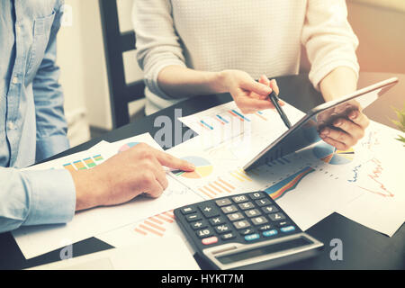 business analysis - people discussing financial graphs and charts at office Stock Photo