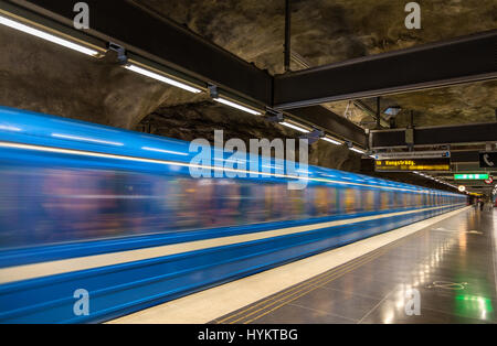 Train leaving Vastra Skogen metro station in Stockholm Stock Photo