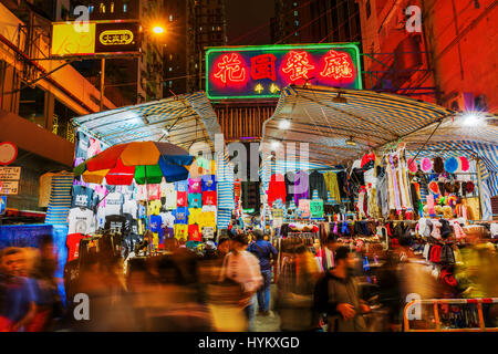 Hong Kong, Hong Kong - March 11, 2017: market stalls and unidentified people at Temple Street. The street is known for its night market and as one of  Stock Photo