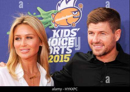 (L-R) Model Alex Curran Gerrard and husband, soccer player Steven Gerrard attend the 2015 Nickelodeon Kids Choice Sports Awards at UCLA on July 16th, 2015 in Los Angeles, California. Stock Photo