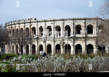 The Roman amphitheatre at Nimes, France, viewed from the gardens of the Esplanade Charles de Gaulle Stock Photo