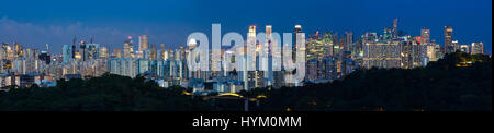 Panorama night view of Singapore Central Business District, city buildings lighted up during the magic hour timing. Stock Photo