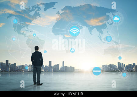International business concept with businessman on city skyline background with network on map and sunlight Stock Photo