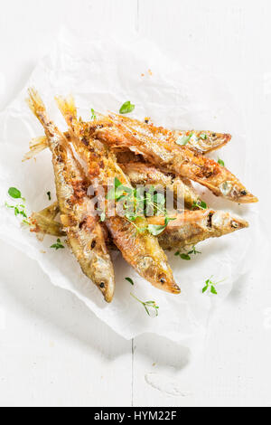 Homemade smelt fish and chips with herbs and salt Stock Photo