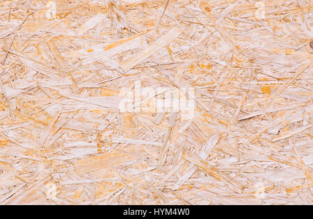 Macro shot of wood chipboard. Background from the pressed sawdust Stock Photo