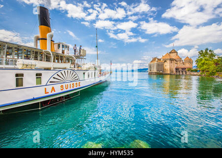 Beautiful view of traditional paddle steamer excursion ship with famous Chateau de Chillon at Lake Geneva in summer, Canton of Vaud, Switzerland Stock Photo