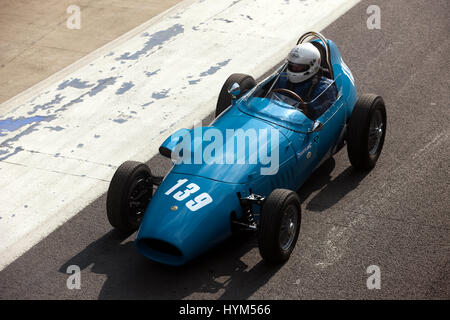 A blue Stanguellini Formula Junior Racing car exiting the International Pit Lane during the 2017 Silverstone Classic media Day Stock Photo