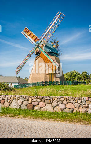 Traditional windmill in beautiful scenery with blue sky and clouds on a sunny day in summer Stock Photo