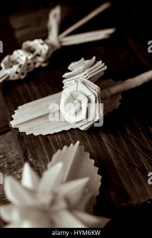 closeup of some small traditional spanish braided palms to be blessed on Palm Sunday on a rustic wooden surface Stock Photo