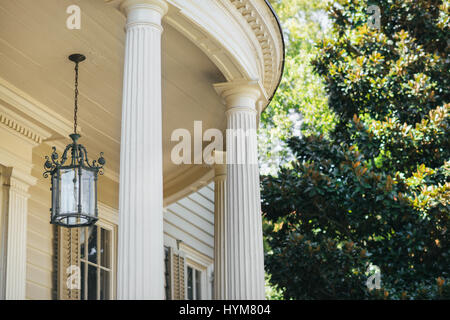 Outdoor lighting fixture and columns of a historic Charleston home in South Carolina. Stock Photo