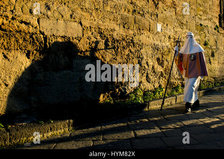 Enna, Sicily, Italy - March 25, 2016:  religious Parade, in town of Enna, Sicily for the Holy Easter which lasts through the afternoon and night. Stock Photo