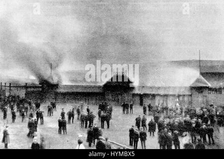 A replay of the game between the finalists in the competition for the Scottish Cup, Glasgow Celtic and Glasgow Rangers. For the second time there was a draw. The crowd desired that there should be an extra half hour's play, but having been refused this wish they rioted. Seen in the image are supporters burning pay boxes at the ground of Queen's Park at Hampden, Mount Florida, Glasgow, Scotland, after disappointed fans burnt everything in sight. Stock Photo