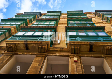 A view from the bottom up to the traditional Maltese style colored  balconies. Valletta. Malta Stock Photo