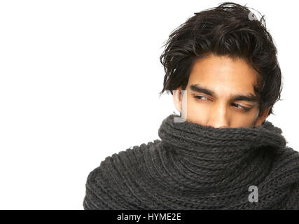 Close up portrait of a mysterious man with face covered by wool scarf Stock Photo