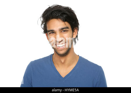Close up portrait of a handsome young indian man smiling on isolated white background Stock Photo