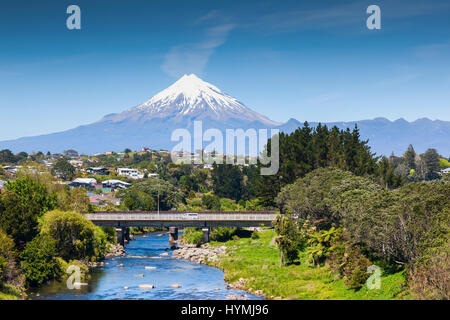 The Waiwhakaiho River, the city of New Plymouth, and Mount Taranaki, New Zealand. Stock Photo