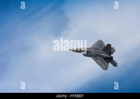 Lockheed Martin F-22 Raptor in flight, turning, sky, copyspace Stock Photo