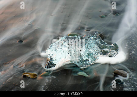 Ice, chunks of ice on lava beach near Jökulsarlon, Suðurland, Southern Region, Iceland Stock Photo