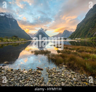 Mitre Peak reflecting in the water, sunset, Milford Sound, Fiordland National Park, Te Anau, Southland Region, Southland Stock Photo