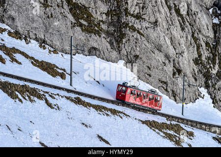 Rack railway going up Mount Pilatus in winter, steepest rack railway in the world, Pilatus, Kriens, Switzerland Stock Photo