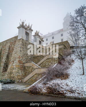 Stairs to Bratislava Castle in a snowy winter morning Stock Photo