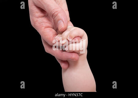 Mommy holding baby's hand Stock Photo