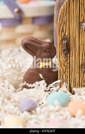 Chocolate Easter Bunny standing at a door Stock Photo