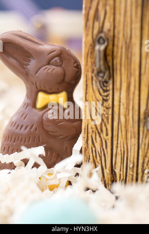 Chocolate Easter Bunny standing at a door Stock Photo