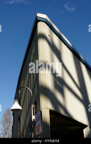 Old wedge-shaped  building clad in corrugated-tin siding on Granville Island, Vancouver, British Columbia, Canada Stock Photo